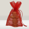 Bougie borne incendie dans son sac en organza rouge