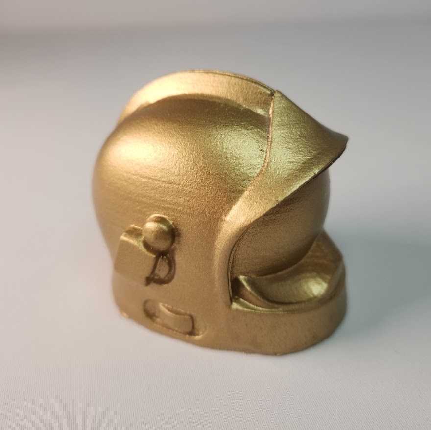 casque de pompier doré en cire 7 cm sans mèche